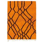 Geometric Moroccan rug in bright orange featuring traditional black diamond lattice design handcrafted with wool