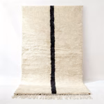 Handwoven traditional Moroccan rug with black single line on ivory wool