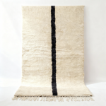 Handwoven traditional Moroccan rug with black single line on ivory wool