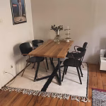Minimalist Moroccan wool rug styled in modern dining room setting