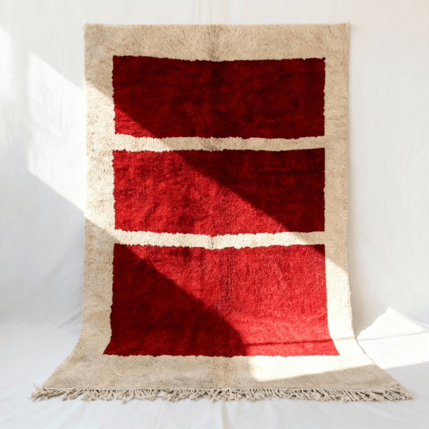 Vibrant red Moroccan area rug with horizontal stripes and handcrafted cream border (1) Red handwoven Moroccan area rug with three horizontal cream stripes on beige border, minimalist grid design