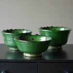 Emerald green ceramic clay bowls with speckled glaze finish on footed base, handcrafted Tamegroute pottery set