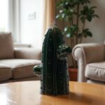 Moroccan green ceramic cactus sculpture showcased as decorative accent piece in contemporary interior