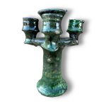 Handcrafted ceramic candlestick holder in emerald green with three candle holders and artisan glaze details