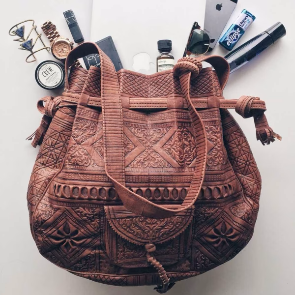 Detail of embossed pattern on tan leather bag