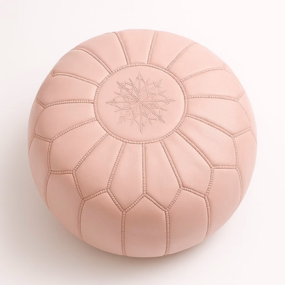 Handcrafted Moroccan pink pouf ottoman with starburst stitching pattern