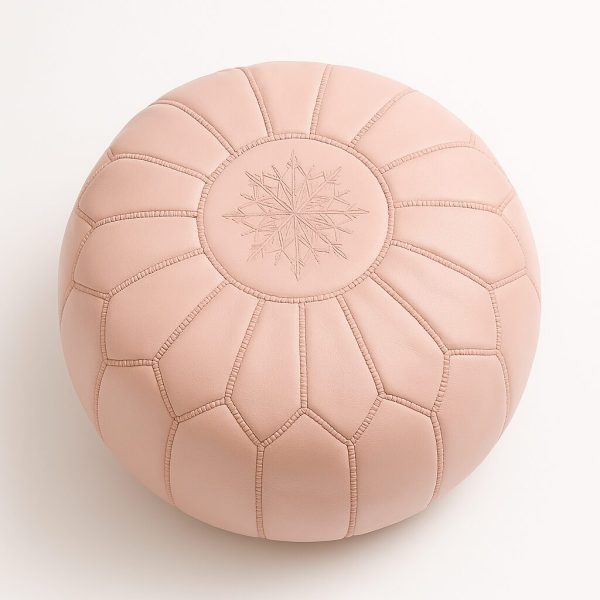 Handcrafted Moroccan pink pouf ottoman with starburst stitching pattern