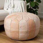 Natural leather floor ottoman 21 inch in living room with white sofa, throw blanket, and houseplant showing warm tan tones