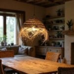 Illuminated handwoven straw lighting creating warm glow through natural palm leaf fibers in cozy dining room