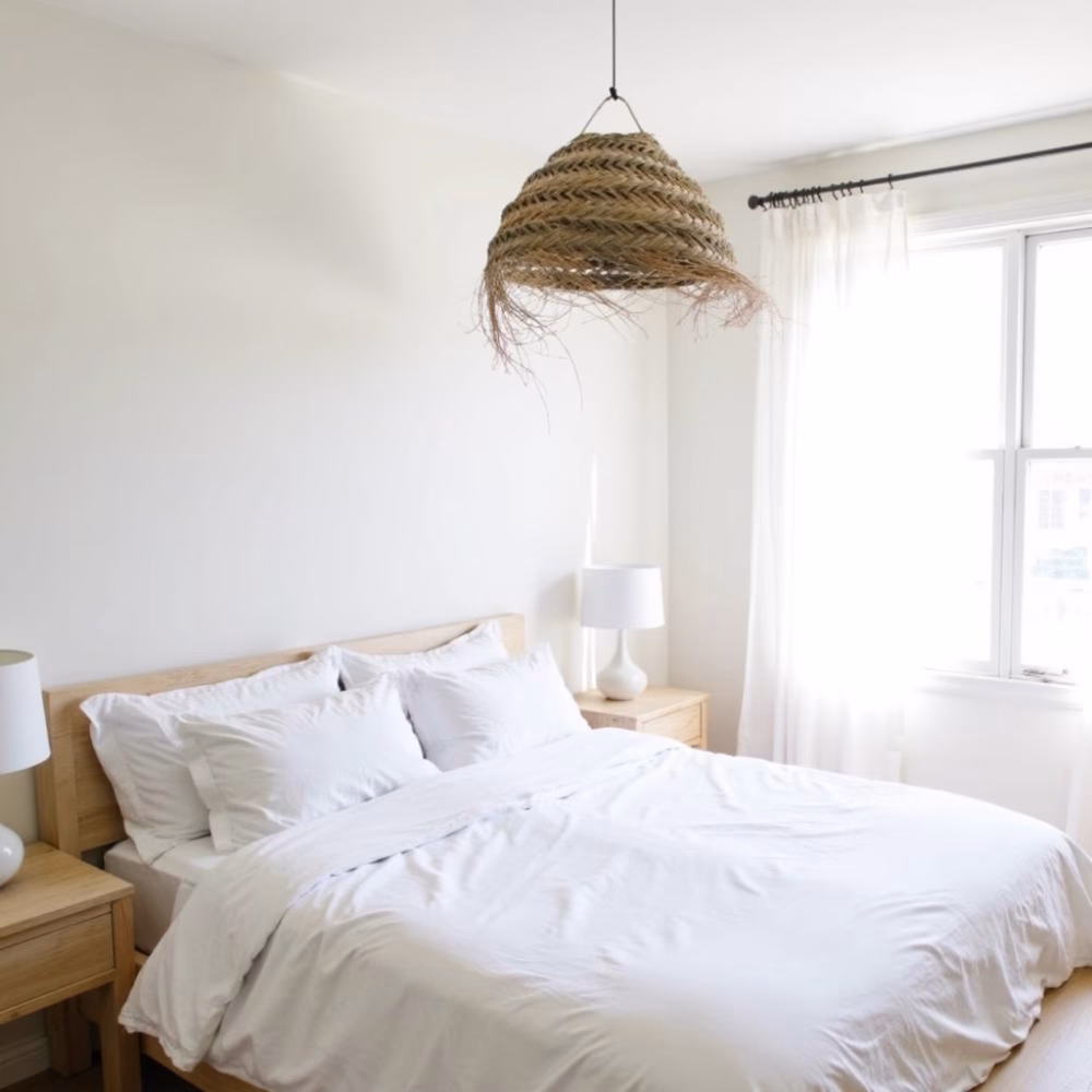 Serene bedroom with natural boho lampshade