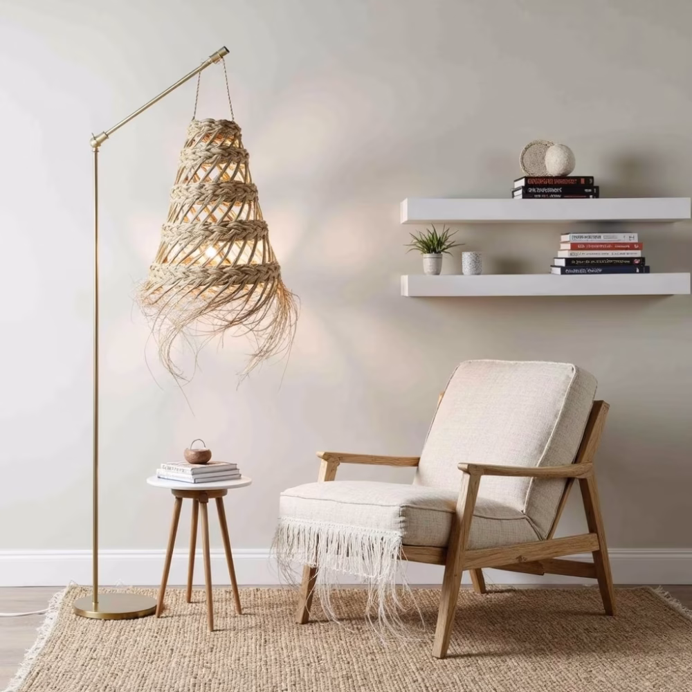 Straw pendant lamp complementing minimalist reading corner with cream armchair
