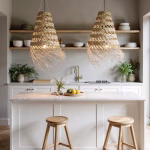 Dual straw light shades above white kitchen island with wooden accents