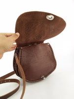 Leather shoulder bag styled in modern home setting