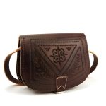 Detailed front view of embossed leather shoulder bag