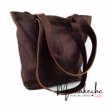 Profile shot of model with leather tote bag
