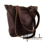 Leather tote bag dark cognac side profile displaying spacious interior and structured shape
