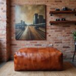 Leather rectangle ottoman 36 inch cognac brown footrest in industrial style room with exposed brick and art