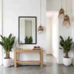 Handwoven straw pendant lights in entryway with console table and natural fringe detail