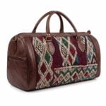 Kilim leather duffle bag main product photo on white background with soft shadow, brown full-grain leather frame and handwoven wool center panel