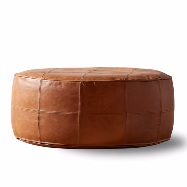 Large Moroccan pouf in light brown leather, studio view