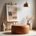 Leather floor ottoman on balcony terrace with cacti plants at sunset golden hour city views