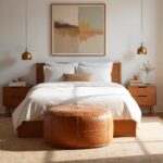 Premium tan leather floor ottoman with geometric stitching in contemporary bedroom neutral palette