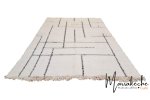 Premium wool Moroccan geometric rug in cream with angular black lines and tassel fringe