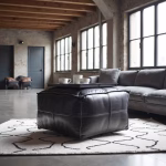 Black leather pouf in modern industrial living room