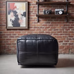 Square leather ottoman at vanity desk