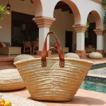 Straw tote bag with leather straps in Mediterranean courtyard setting