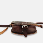 Detail shot of brown leather shoulder bag's craftsmanship