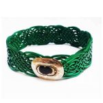 Green braided leather belts for women with intricate Celtic knot design and gold medallion buckle with black stone