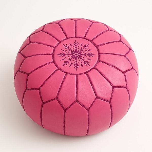 Handcrafted Moroccan pink pouf with starburst stitching pattern, top view