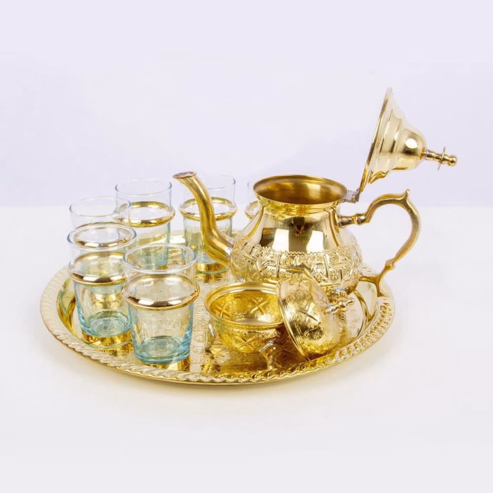 Overhead view of complete tea service showing geometric pattern arrangement