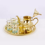 Overhead view of complete tea service showing geometric pattern arrangement