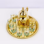 Close-up of traditional tea glasses with gold-tone accents