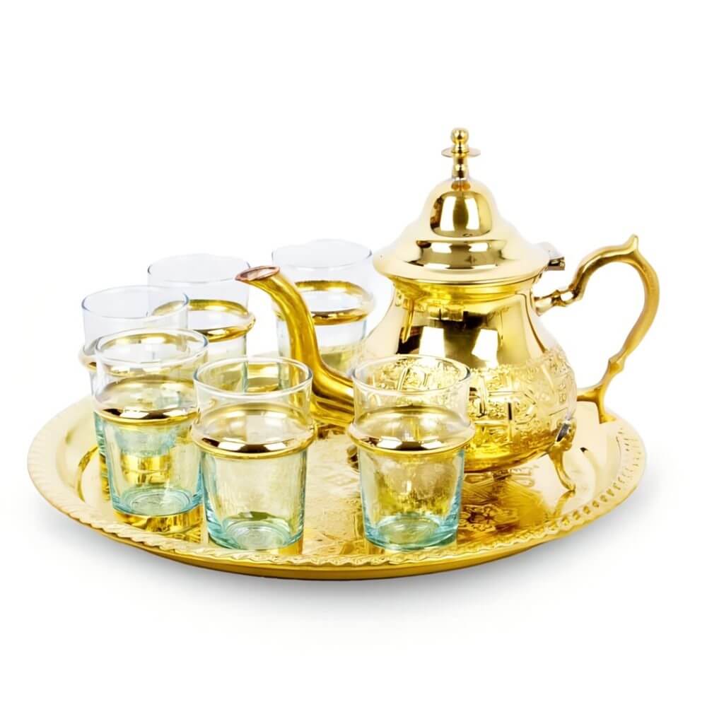 Close-up of hand-engraved brass teapot showing traditional Moroccan patterns