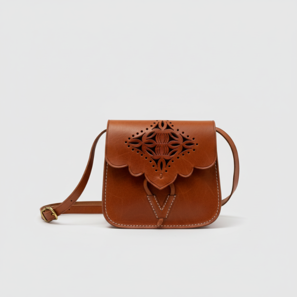 Front view of handcrafted Moroccan brown leather shoulder bag with cutout design