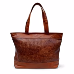 Product photo highlighting woven leather handbag