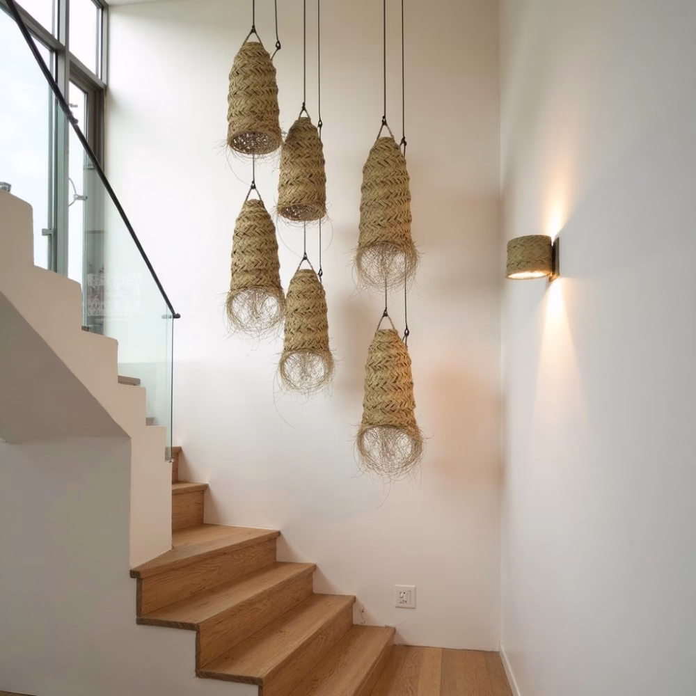 Modern staircase with multiple hanging lamp shades