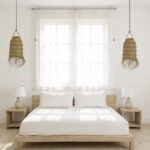 Handwoven straw lighting in bedroom with symmetrical bedside placement showing natural cylindrical design