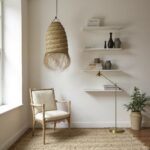 Handwoven straw lighting pendant in reading nook with vintage chair and natural herringbone pattern detail