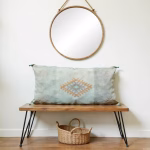 Geometric pattern cactus silk pillow on wooden bench