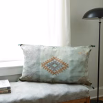Minimalist bedroom with silk cactus pillow cover