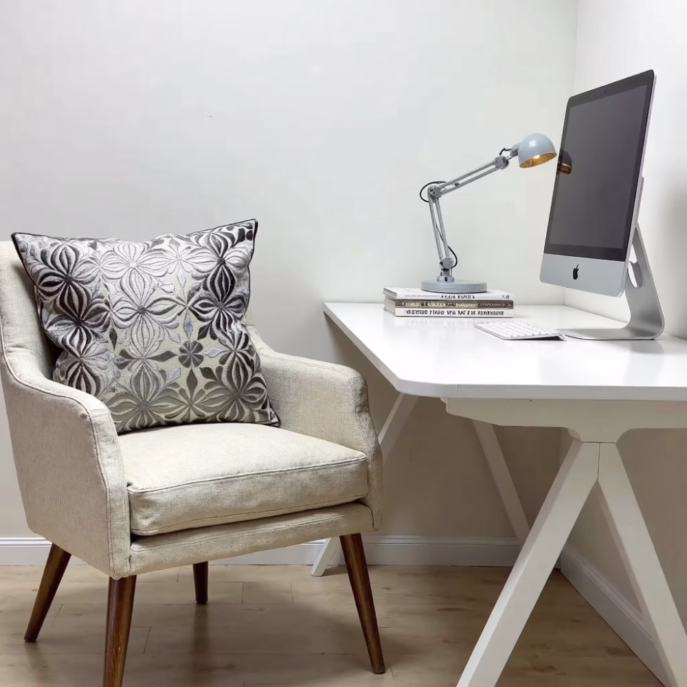 Gray embroidered Moroccan pillow cover in home office setting