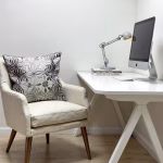Gray embroidered Moroccan pillow cover in home office setting