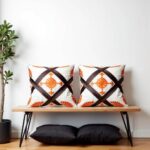 Berber diamond pillow covers pair displayed on modern bench showing detailed appliqué craftsmanship and pattern