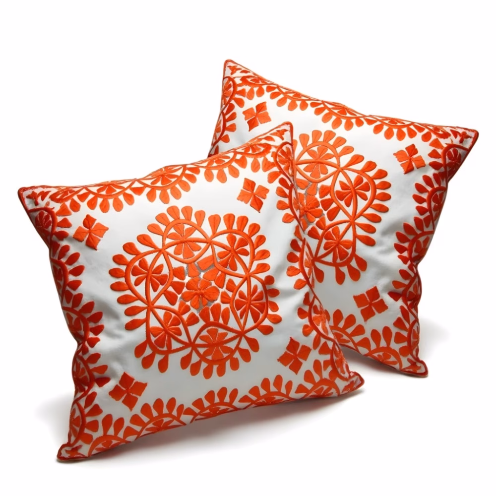 Product photo of orange embroidered cushion set