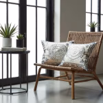 Set of circular pattern embroidered pillows with modern furniture