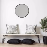 Set of circular pattern embroidered pillows with modern furniture